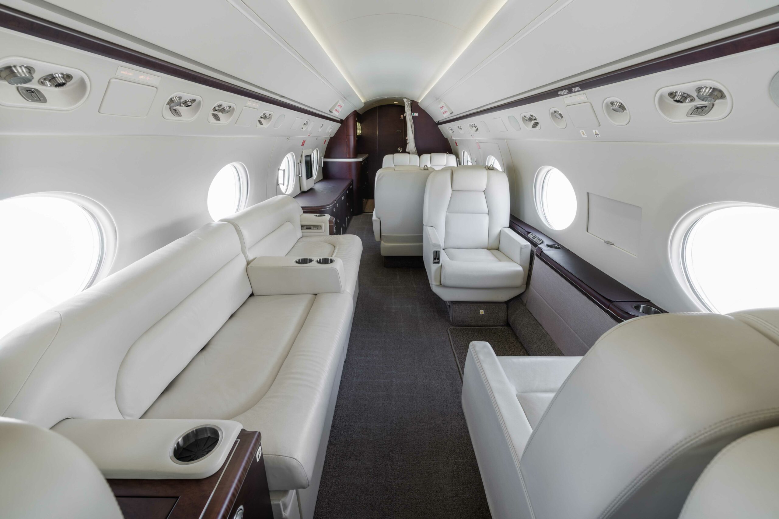 Mid-cabin view of Gulfstream G550 SN5127 showing luxurious white leather seating and cabin layout